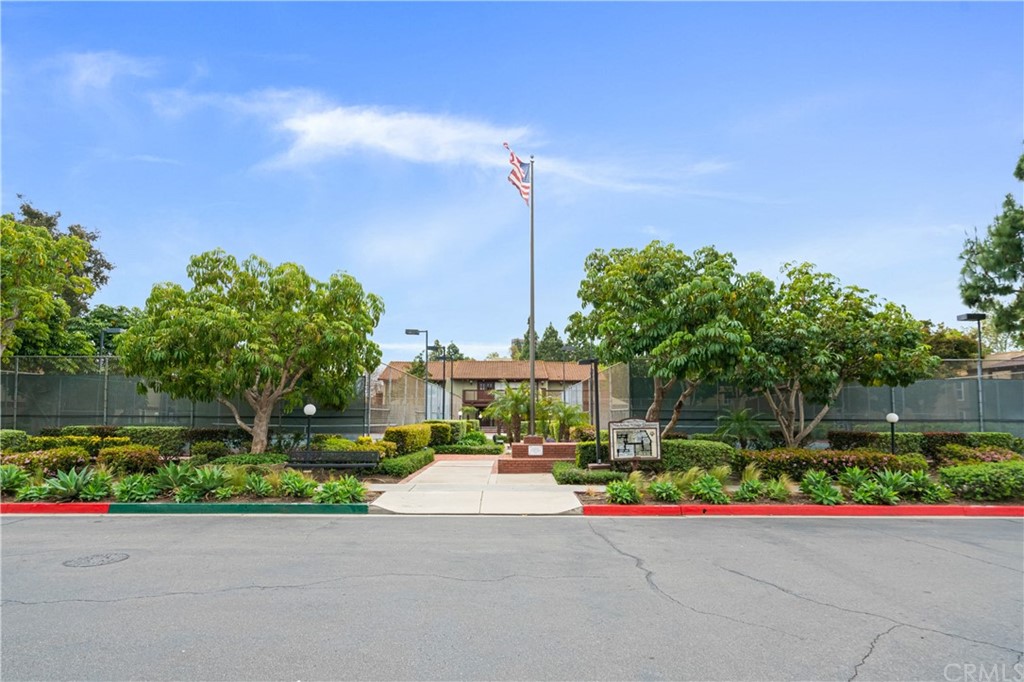 1040 West MacArthur Boulevard, Unit 104 Santa Ana, CA 92707 - Photo 30 of 30 a front view of a house with a street