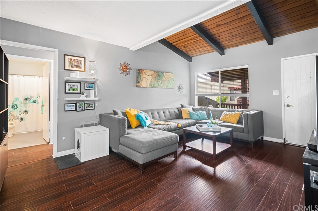1040 West MacArthur Boulevard, Unit 104 Santa Ana, CA 92707 - Photo 3 of 30 a living room with furniture and wooden floor