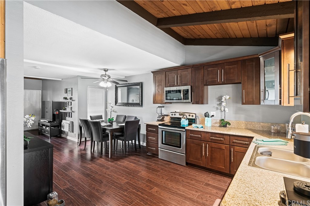 1040 West MacArthur Boulevard, Unit 104 Santa Ana, CA 92707 - Photo 9 of 30 a kitchen with lots of counter top space and appliances
