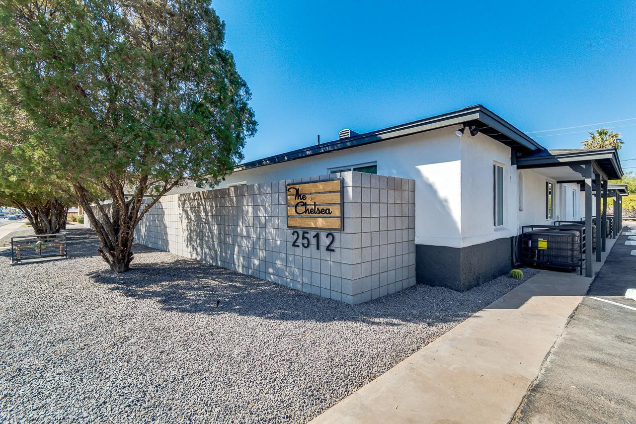 2512 East Thomas Road, Unit 1 Phoenix, AZ 85016 - Photo 7 of 24 a view of a house with a yard and garage