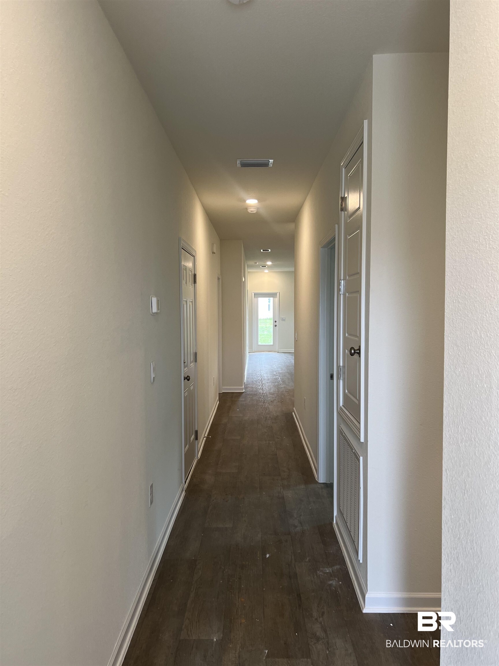 12829 Patriot Way Daphne, AL 36527 - Photo 6 of 38 Hall with dark hardwood / wood-style floors