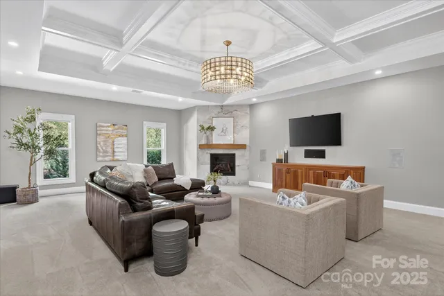 a living room with fireplace furniture and a flat screen tv