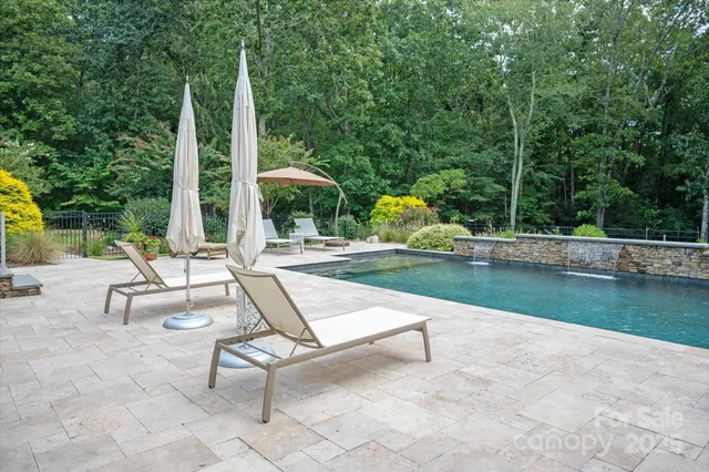 a view of swimming pool with a patio
