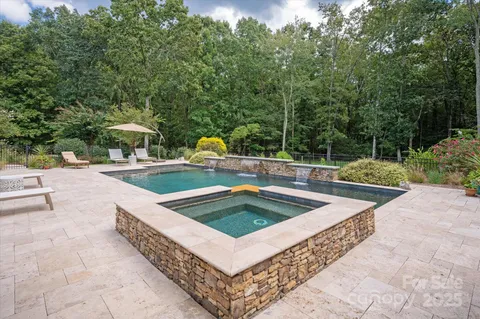 a view of a swimming pool with a patio