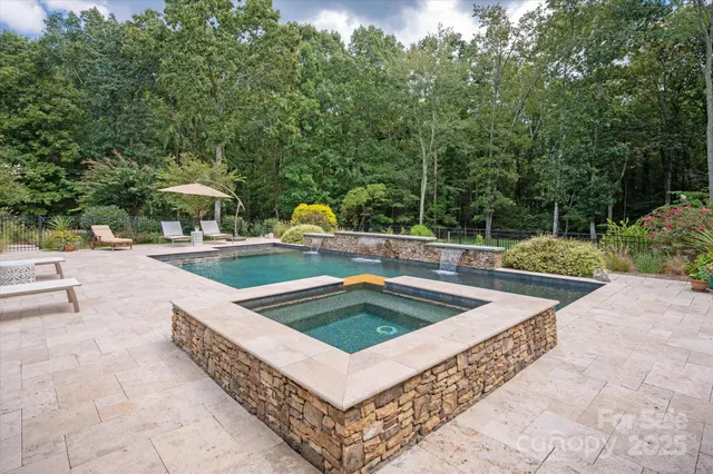 a view of a swimming pool with a patio