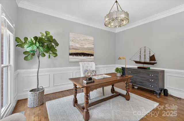 a workspace with furniture and a potted plant