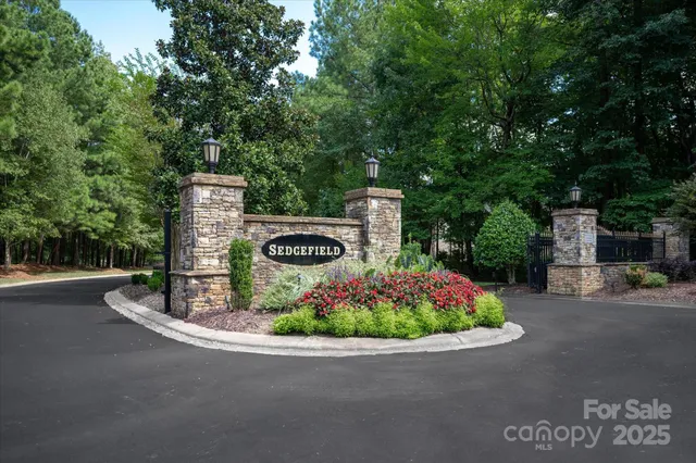 a sign board with a small yard