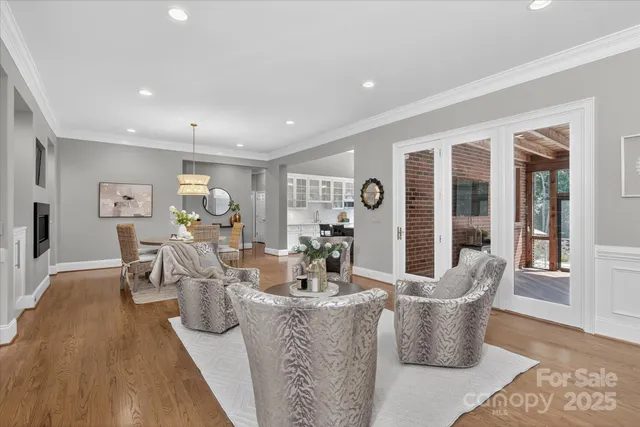 a dining room with furniture and wooden floor