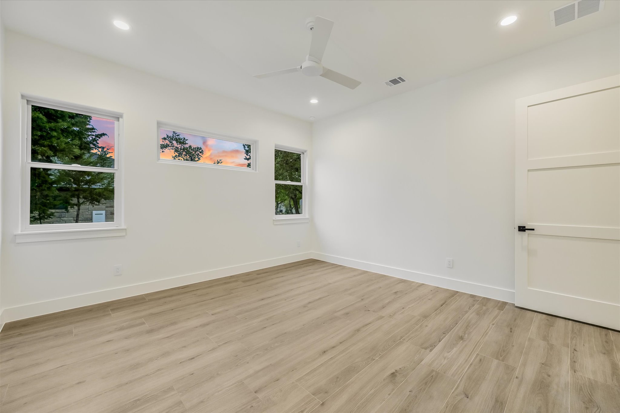 410 Shady Tree Drive Georgetown, TX 78633 - Photo 18 of 40 Spare room featuring light wood-style floors, ceiling fan, and recessed lighting