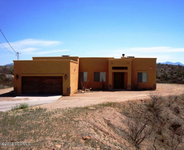 64 Camino Pesqueira Rio Rico, AZ 85648 - Photo 1 of 10 a front view of a house with a yard