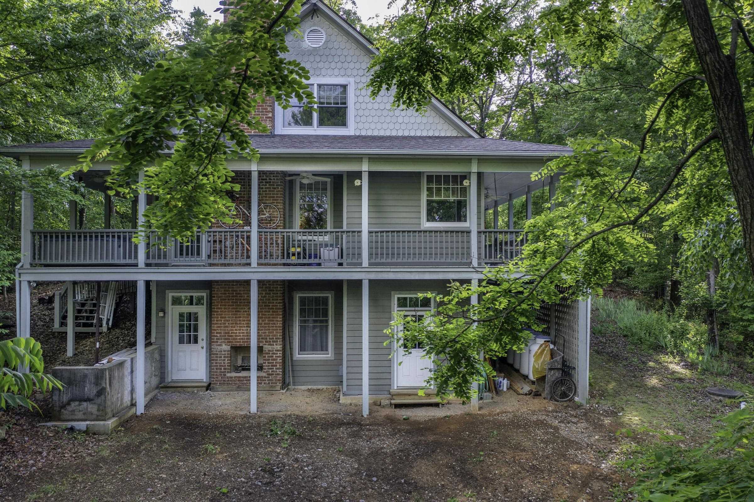 151 Stonebrook Road Amherst, VA 24521 - Photo 3 of 74 Elevated porch wraps around the back of the house. Lower level "patio" features a wood-burning fireplace for outdoor gatherings.
