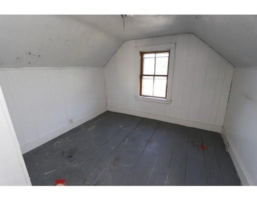 17 Moon Street Southbridge, MA 01550 - Photo 6 of 19 a view of an empty room with wooden floor and a window