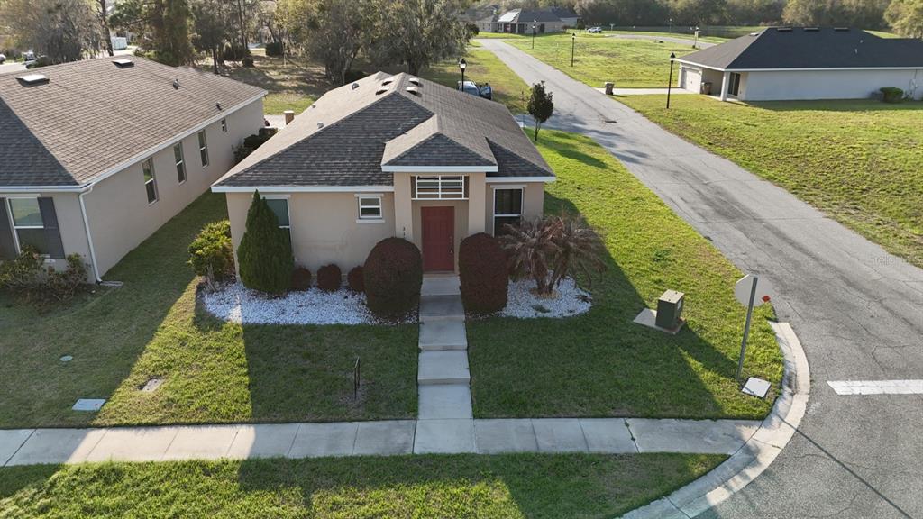 a aerial view of a house with a yard