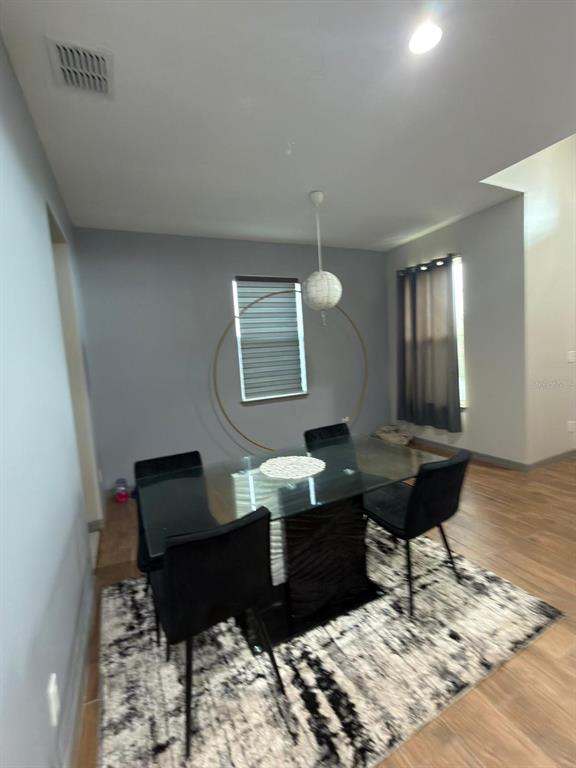 3100 Rocky River Road Kissimmee, FL 34746 - Photo 11 of 33 a living room with furniture and a wooden floor