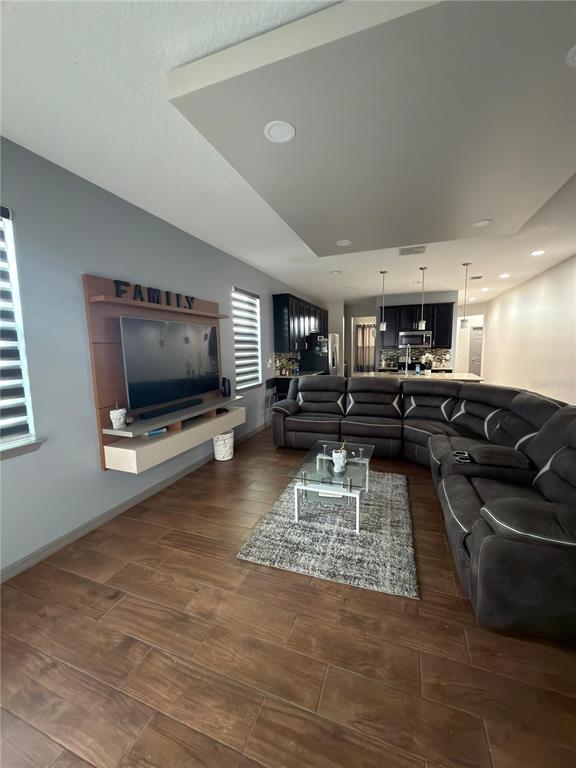 3100 Rocky River Road Kissimmee, FL 34746 - Photo 20 of 33 a living room with furniture and a flat screen tv