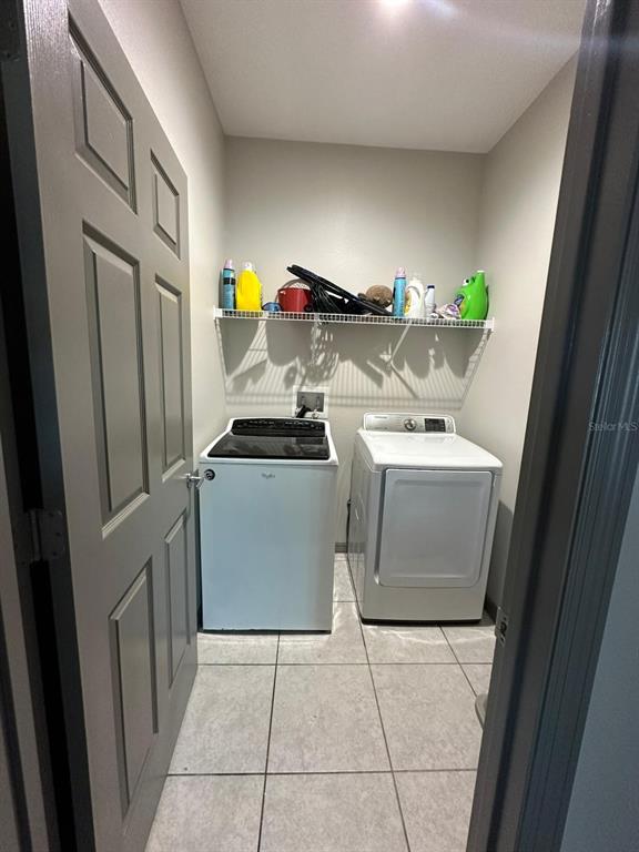 3100 Rocky River Road Kissimmee, FL 34746 - Photo 25 of 33 a utility room with dryer and washer