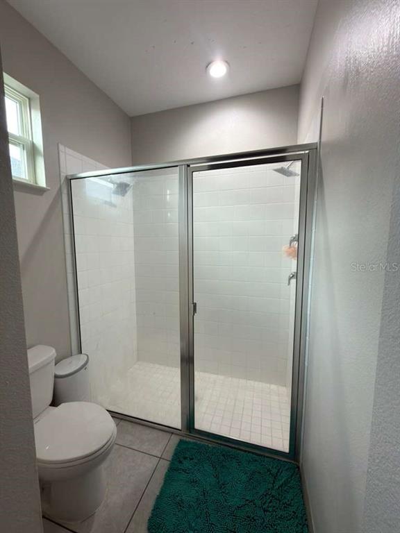 3100 Rocky River Road Kissimmee, FL 34746 - Photo 29 of 33 a bathroom with a shower and a toilet