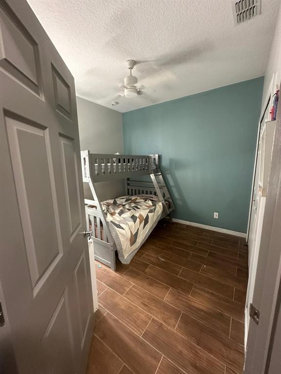 3100 Rocky River Road Kissimmee, FL 34746 - Photo 31 of 33 a bed sitting in a bedroom next to a window