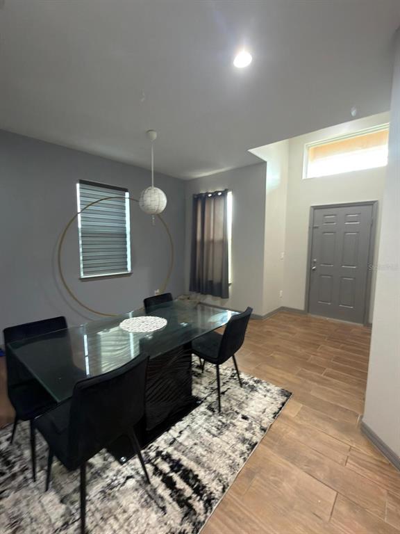 3100 Rocky River Road Kissimmee, FL 34746 - Photo 9 of 33 a living room with a couch and a bookshelf with wooden walls