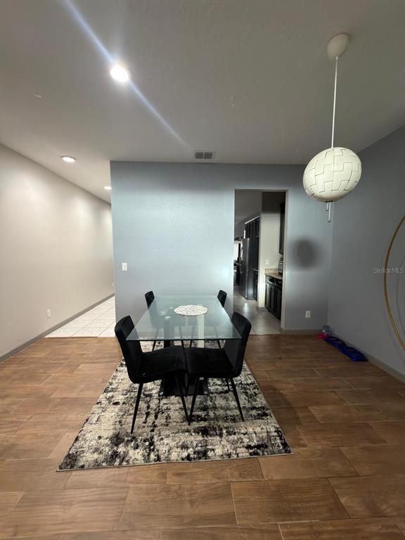 3100 Rocky River Road Kissimmee, FL 34746 - Photo 10 of 33 a view of a room with a table wooden table and chairs