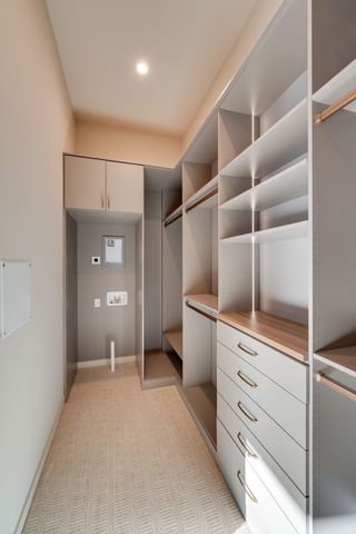 a view of a kitchen with cabinets