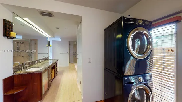 a view of a kitchen with washer and dryer