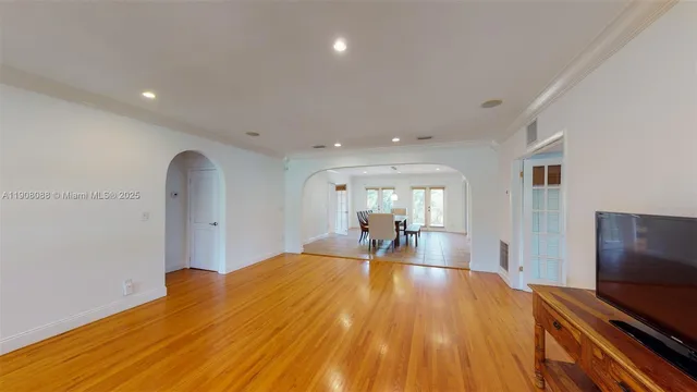 a view of a dining room with furniture and wooden floor