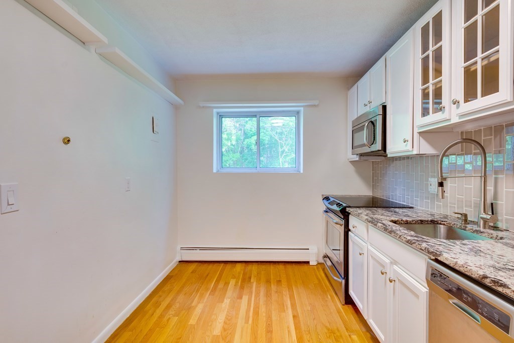 41 Westgate Road, Unit 3 Chestnut Hill, MA 02467 - Photo 11 of 18 a kitchen with a sink and a stove top oven