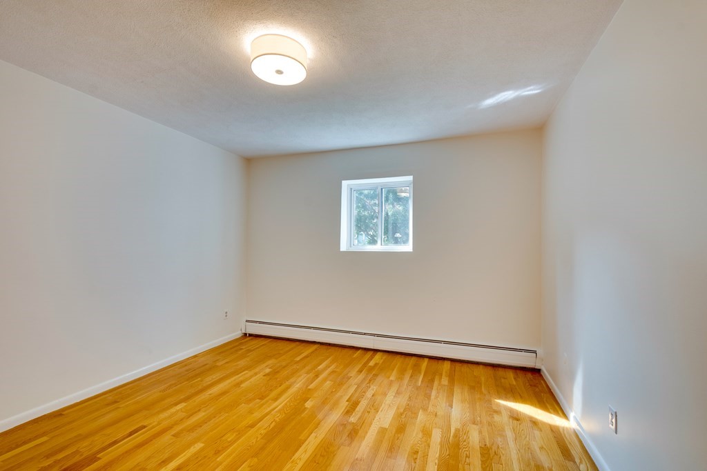 41 Westgate Road, Unit 3 Chestnut Hill, MA 02467 - Photo 12 of 18 a view of empty room with wooden floor
