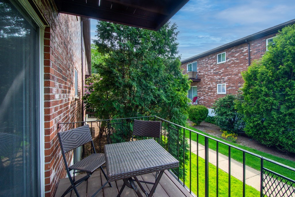 41 Westgate Road, Unit 3 Chestnut Hill, MA 02467 - Photo 17 of 18 a view of a balcony with furniture