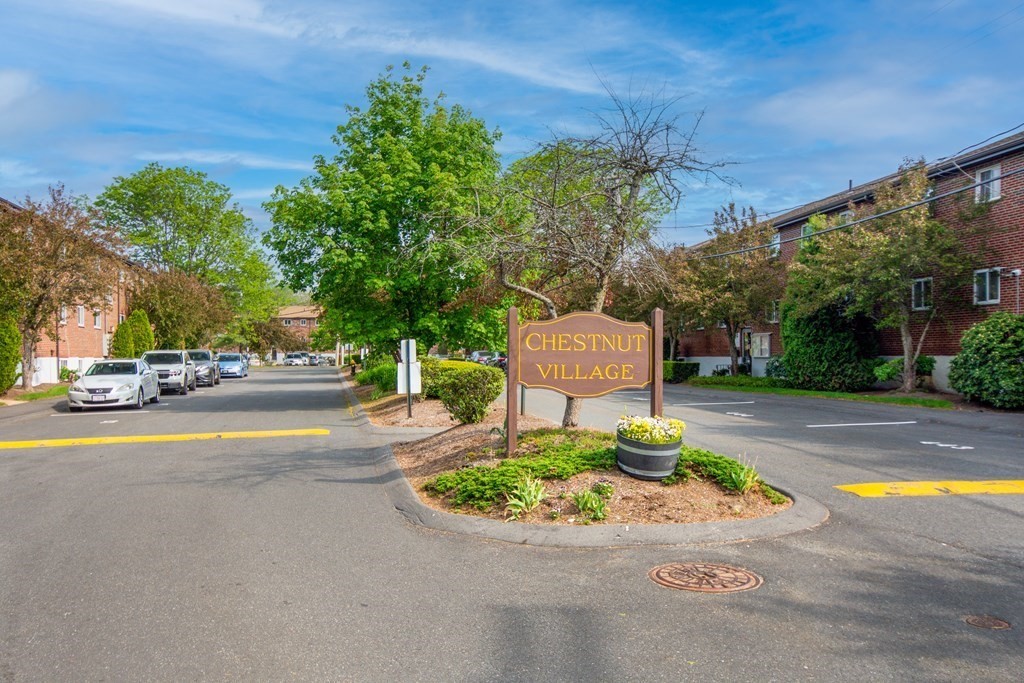 41 Westgate Road, Unit 3 Chestnut Hill, MA 02467 - Photo 2 of 18 a view of a street with houses on both side