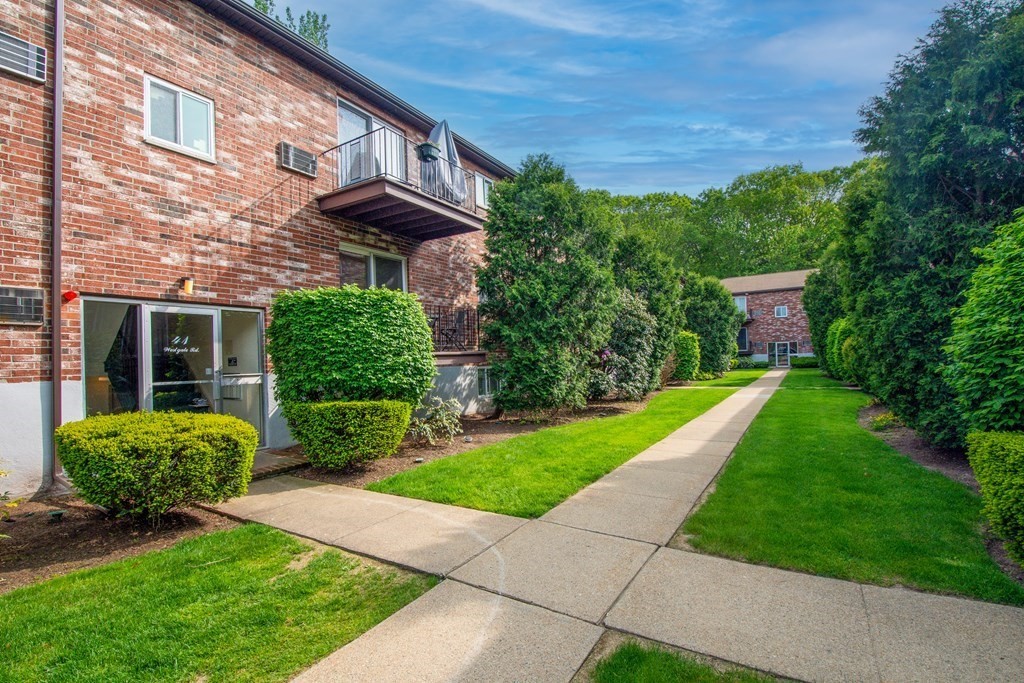 41 Westgate Road, Unit 3 Chestnut Hill, MA 02467 - Photo 3 of 18 a view of a house with a yard