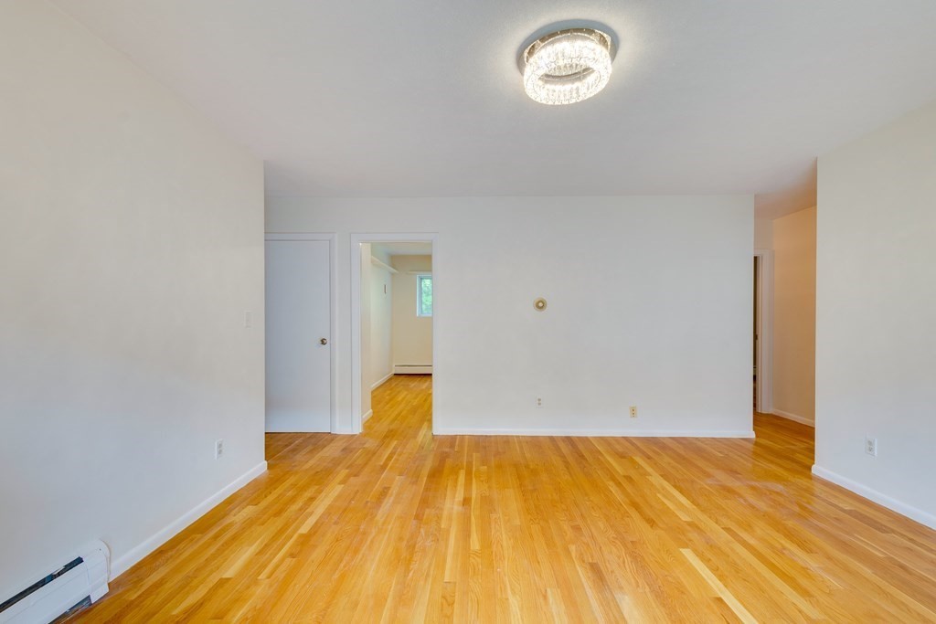41 Westgate Road, Unit 3 Chestnut Hill, MA 02467 - Photo 9 of 18 a view of empty room with wooden floor