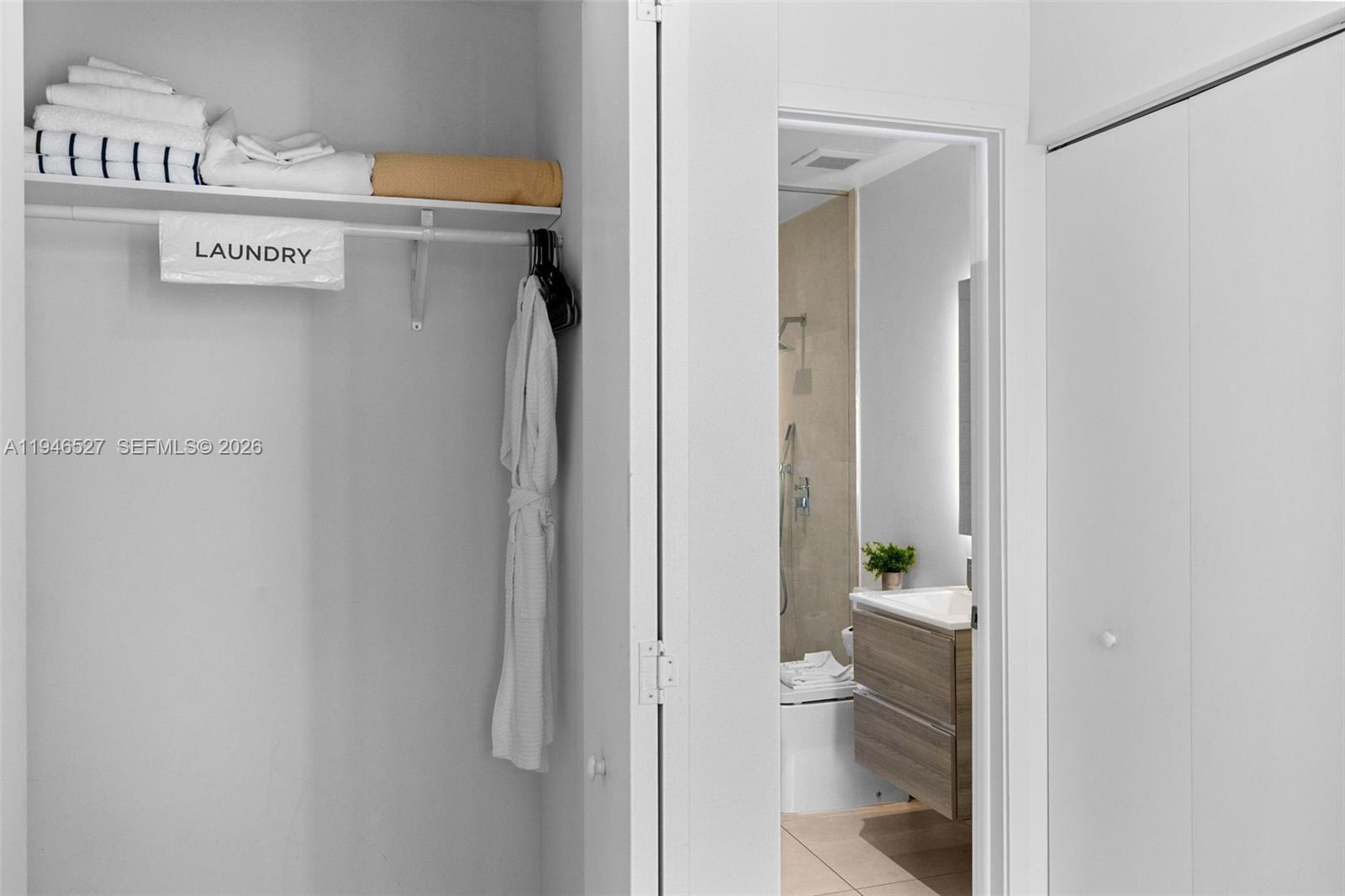 239 Southwest 9th Street, Unit 2304 Miami, FL 33130 - Photo 17 of 35 a view of a bathroom with a glass door