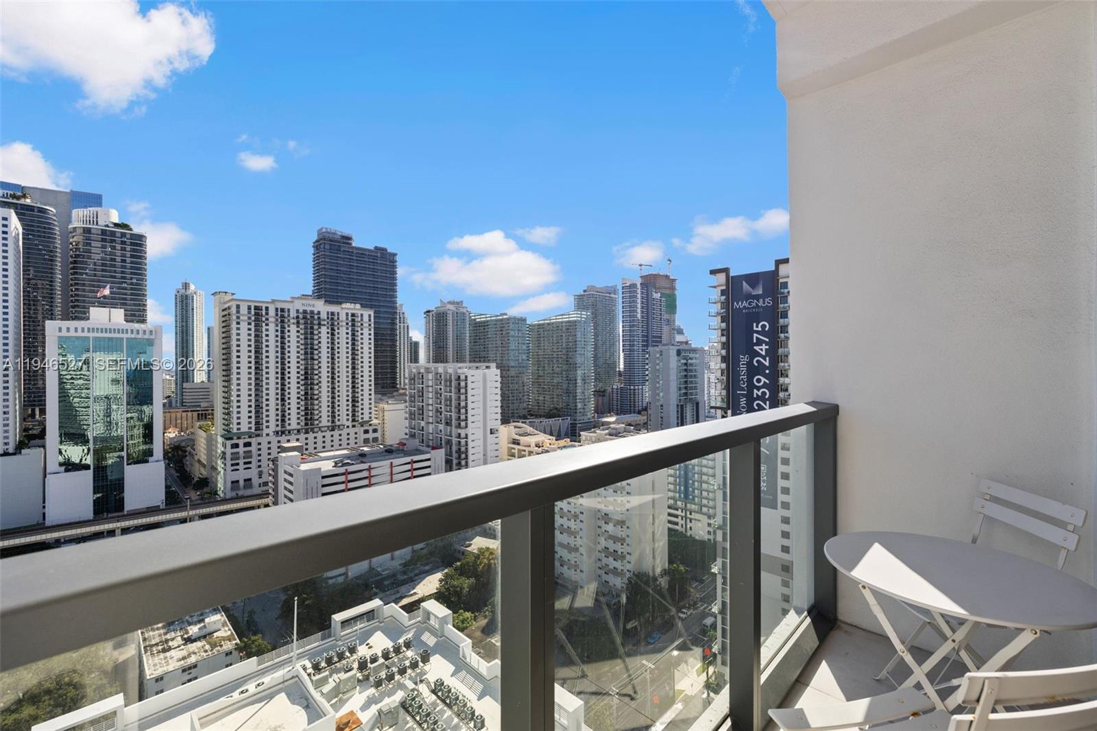 239 Southwest 9th Street, Unit 2304 Miami, FL 33130 - Photo 32 of 35 a view of a city from a balcony with furniture