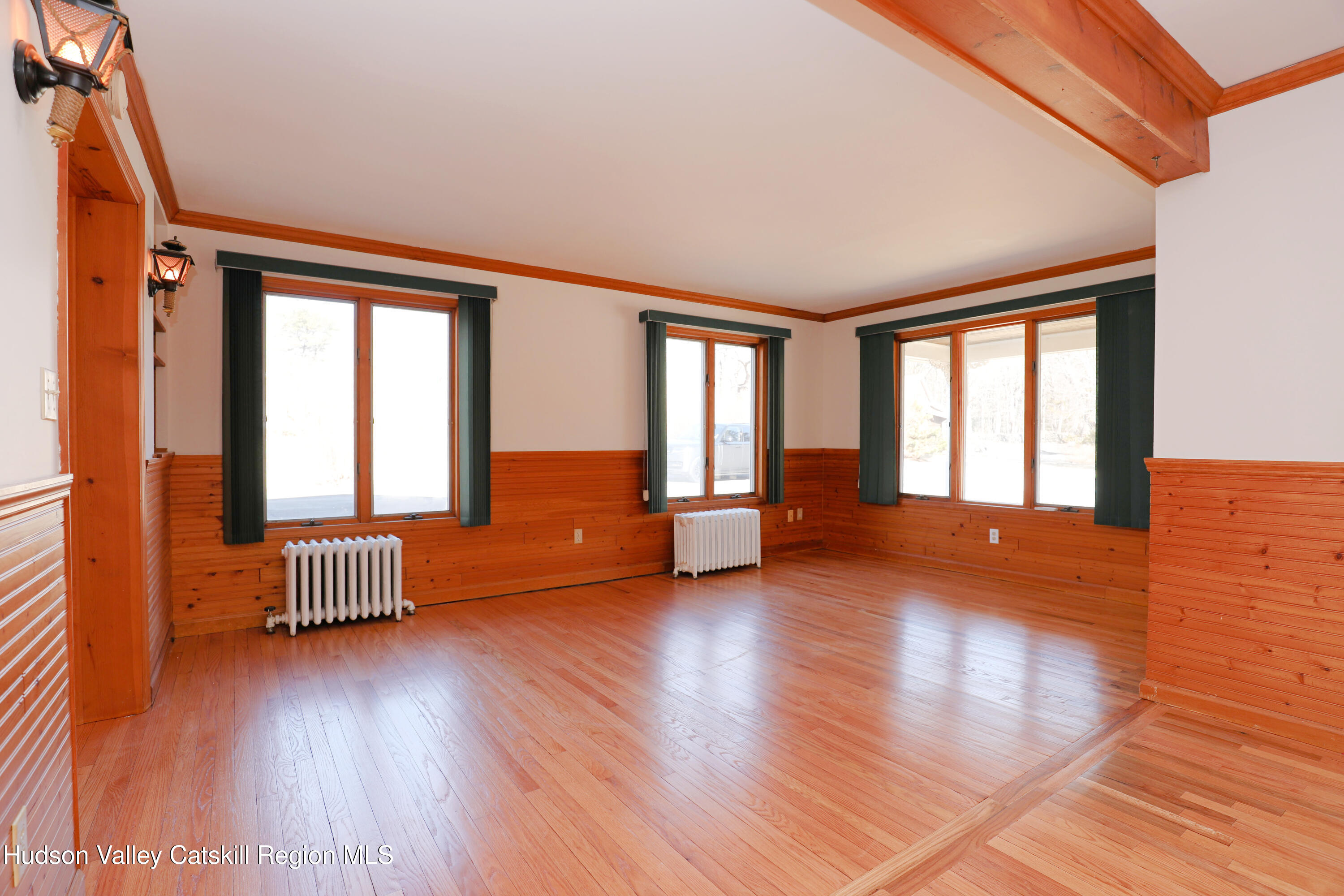 353 West Saugerties Road Saugerties, NY 12477 - Photo 5 of 21 a view of an empty room with glass door and wooden floor