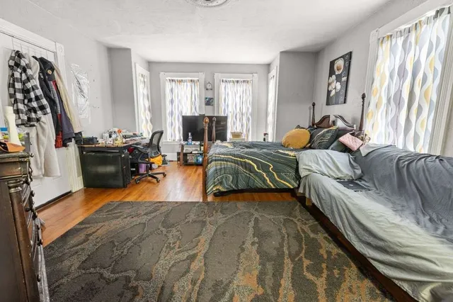 a bedroom with bed and a couch