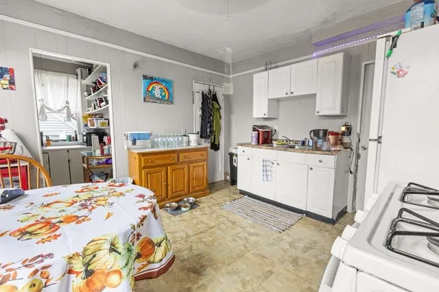 a bed room with a bed and a television