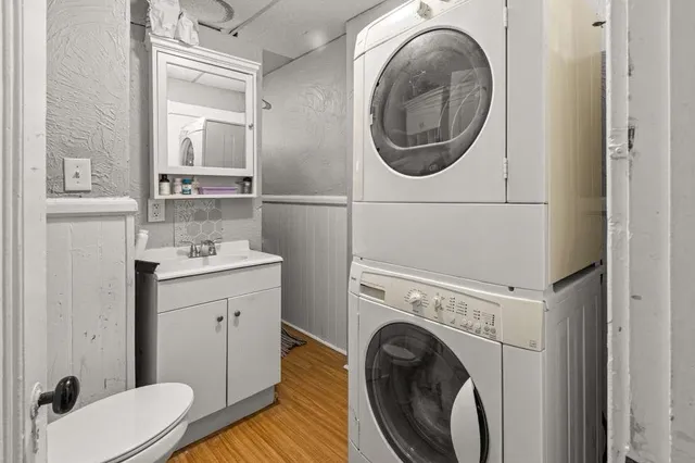 a bathroom with a sink and a washer dryer