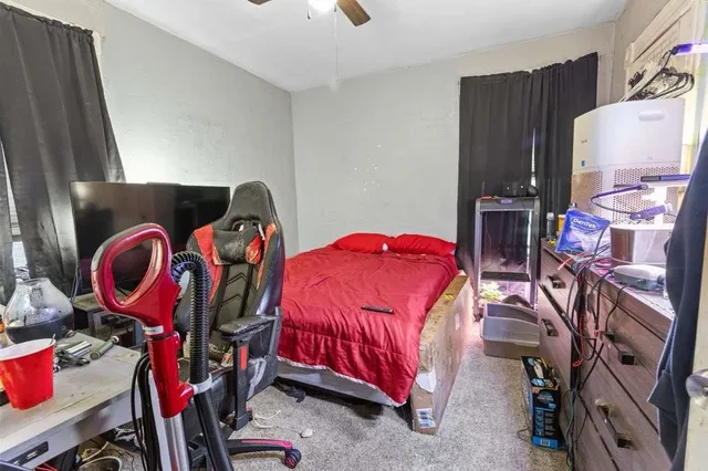 a bedroom with a bed a closet and storage