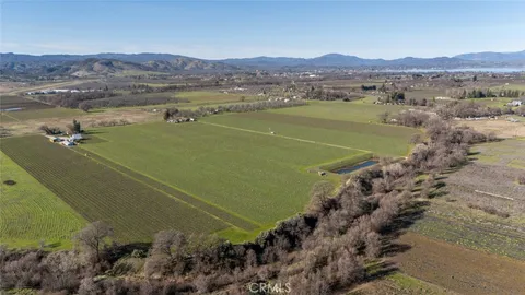 a view of a field with an ocean view