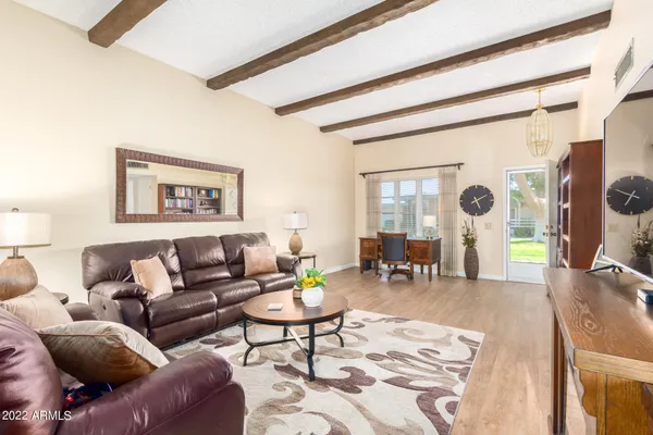 a living room with furniture and a large window