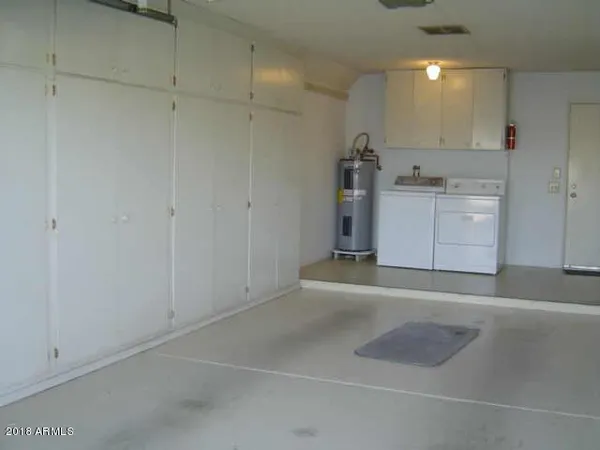 a view of a storage & utility room with a sink