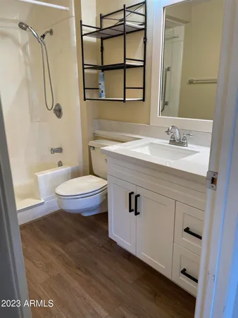 a view of a kitchen with a sink and cabinets