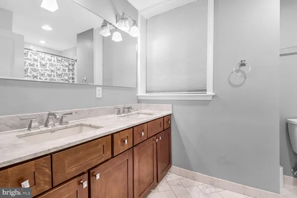 a bathroom with a sink a vanity and a mirror