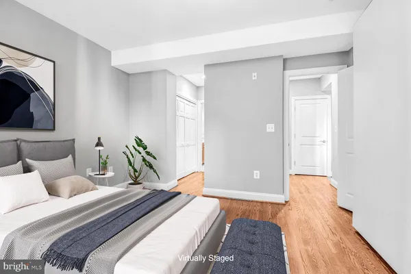 a bedroom with a bed and hallway