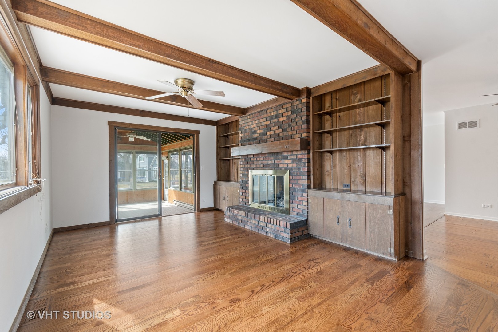 972 West Bauer Road Naperville, IL 60563 - Photo 11 of 32 a view of an empty room with wooden floor and a window