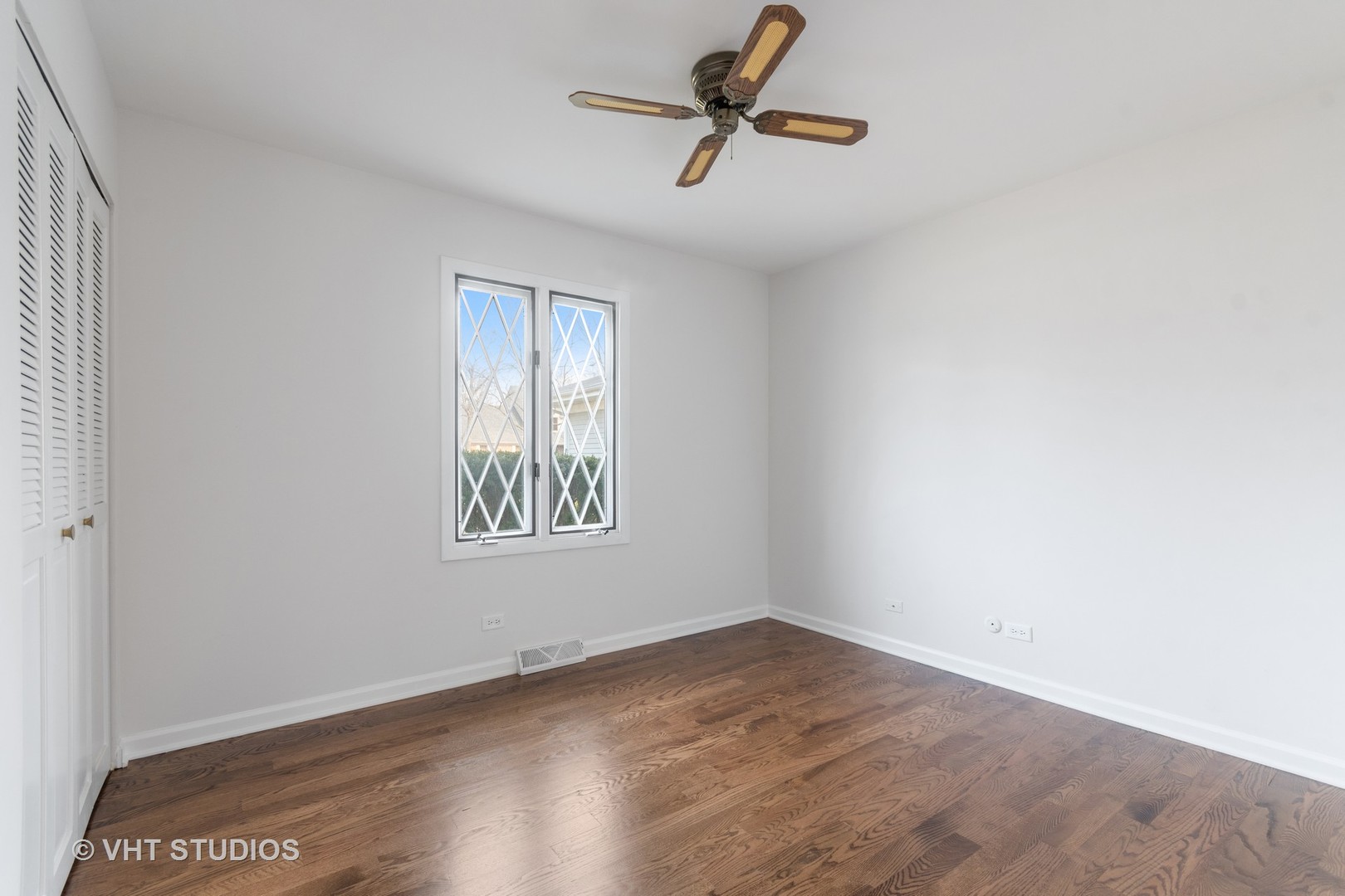 972 West Bauer Road Naperville, IL 60563 - Photo 17 of 32 wooden floor in an empty room with a window