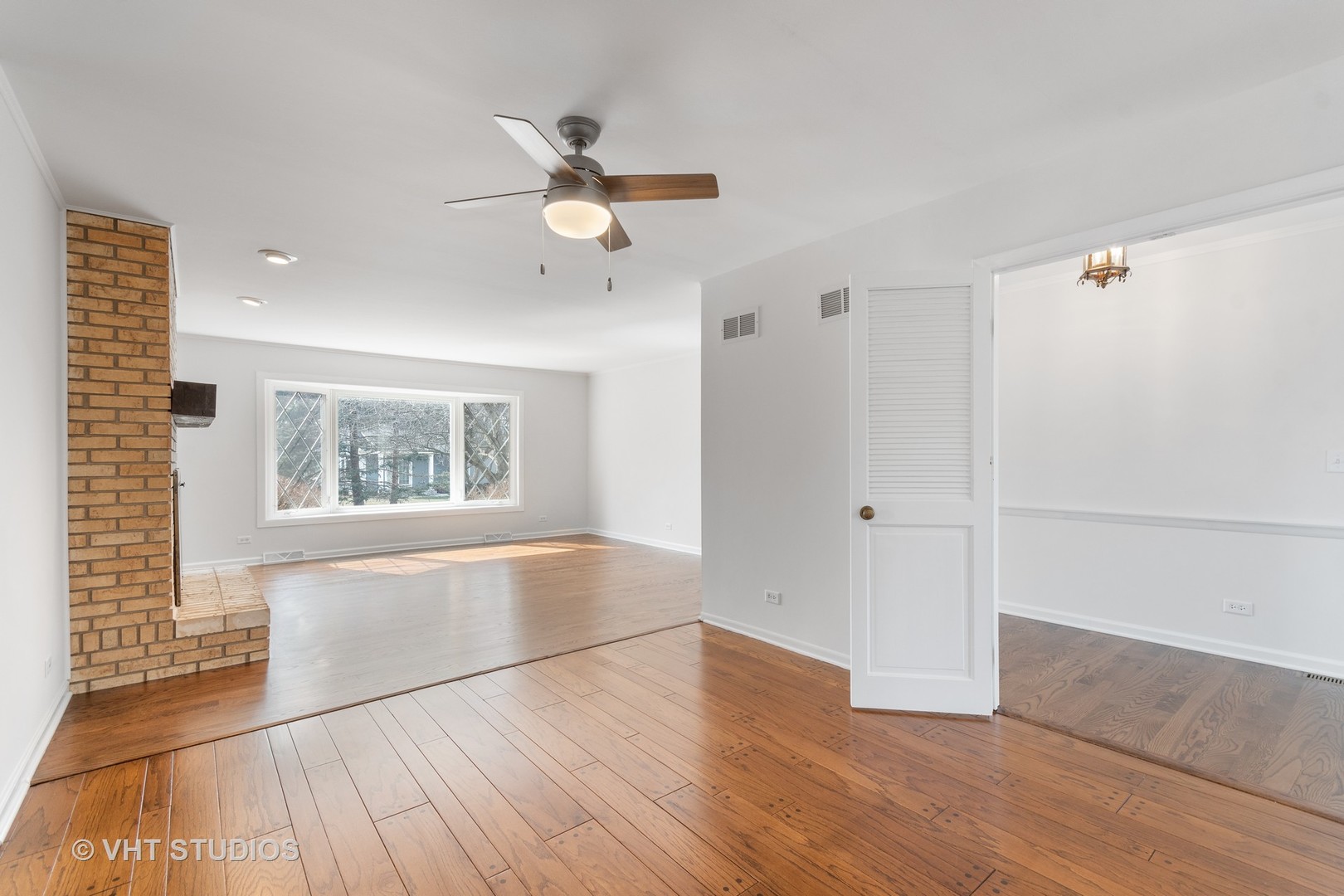 972 West Bauer Road Naperville, IL 60563 - Photo 6 of 32 wooden floor in an empty room with a window