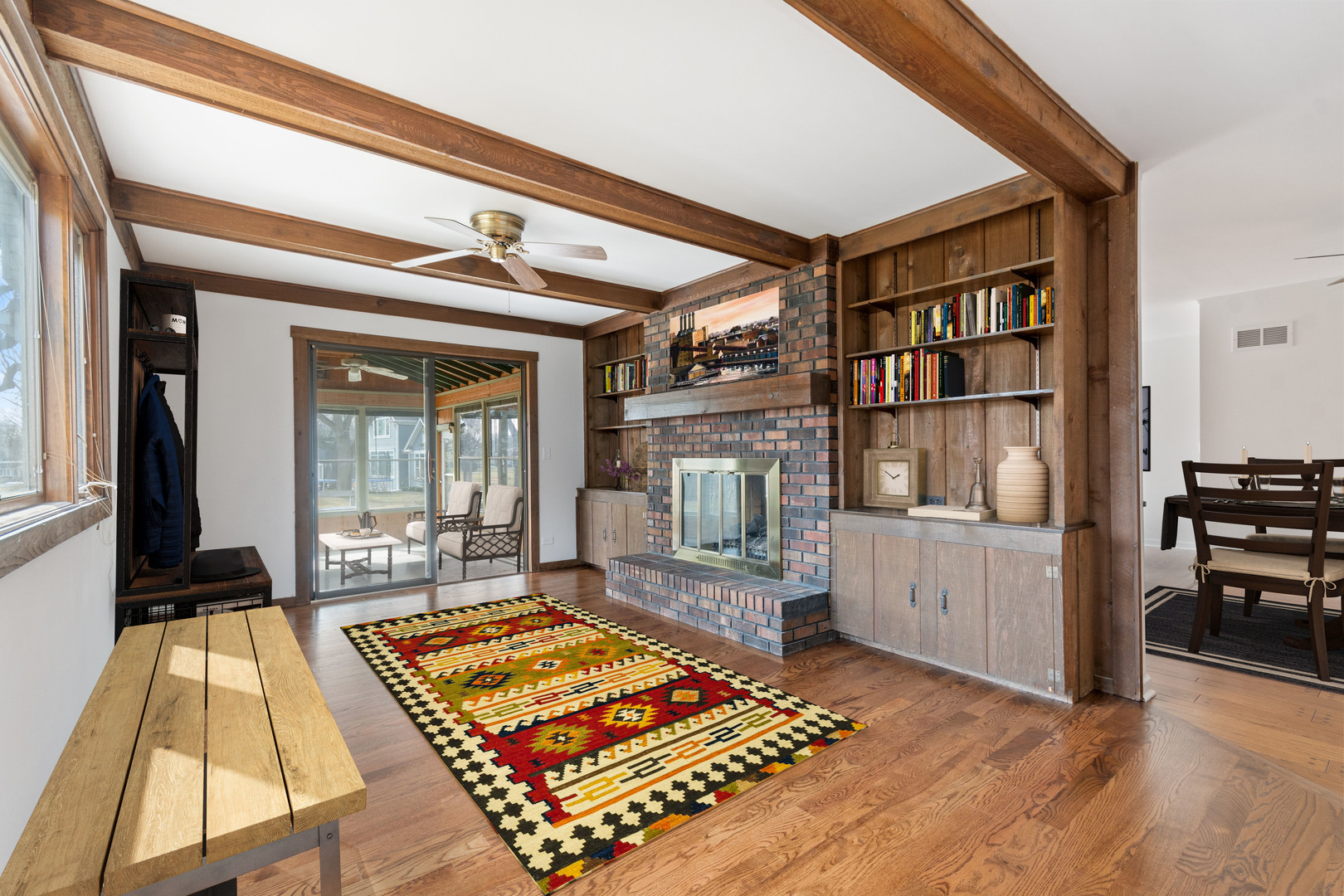 972 West Bauer Road Naperville, IL 60563 - Photo 10 of 32 a living room with furniture a rug and a table
